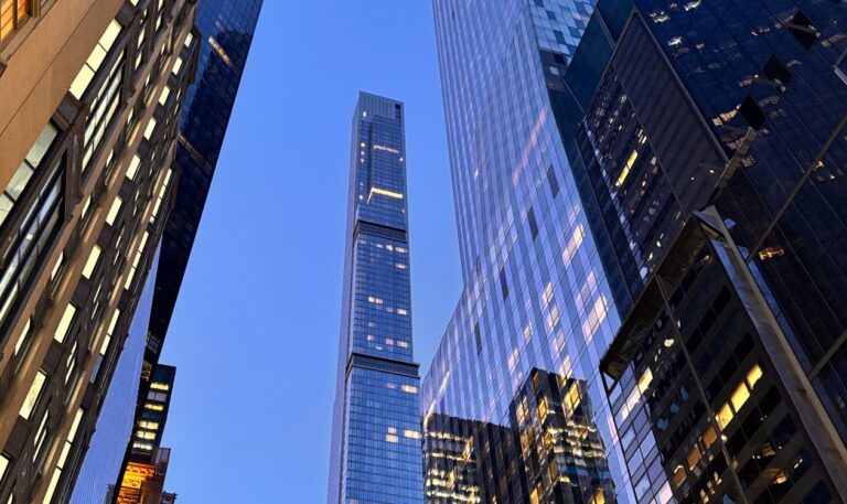 Glass skyscrapers in New York City’s financial district at dusk.