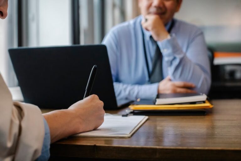 Applicant completes paperwork during an office job interview