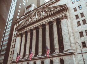 New York Stock Exchange stone facade, columns and American flags