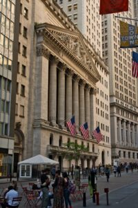 New York Stock Exchange columns and American flags on Broad Street
