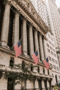 American flags on the New York Stock Exchange facade on Wall Street