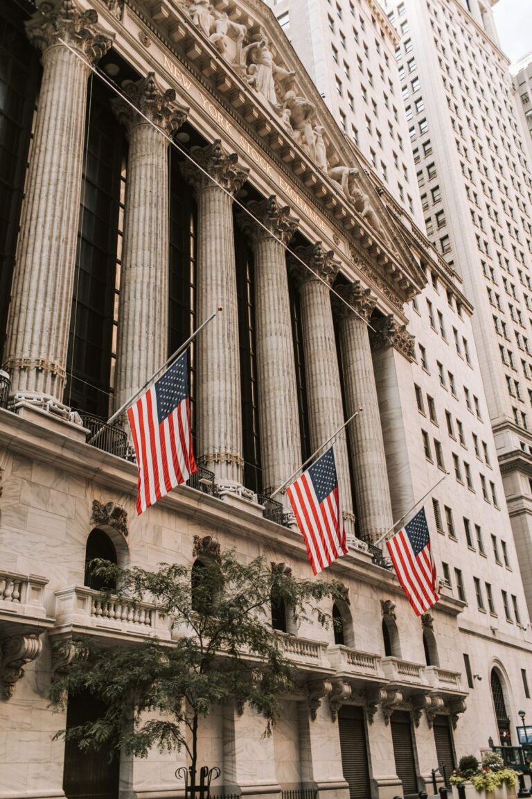 American flags on the New York Stock Exchange facade on Wall Street